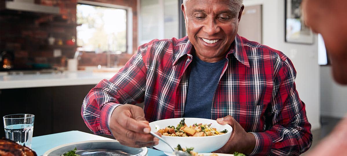 man serving dinner