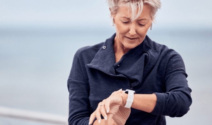 Woman looking at her watch