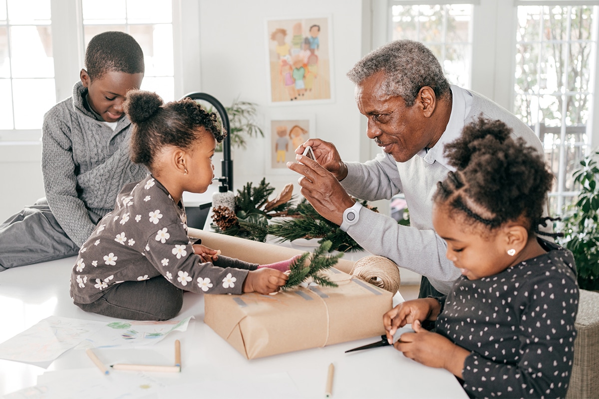 Grandfather and Grandkids Wrapping Presents