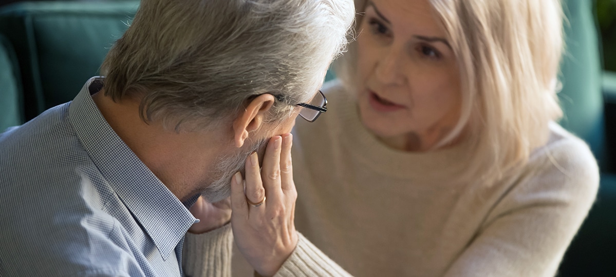 Woman Looking at Man with Concern